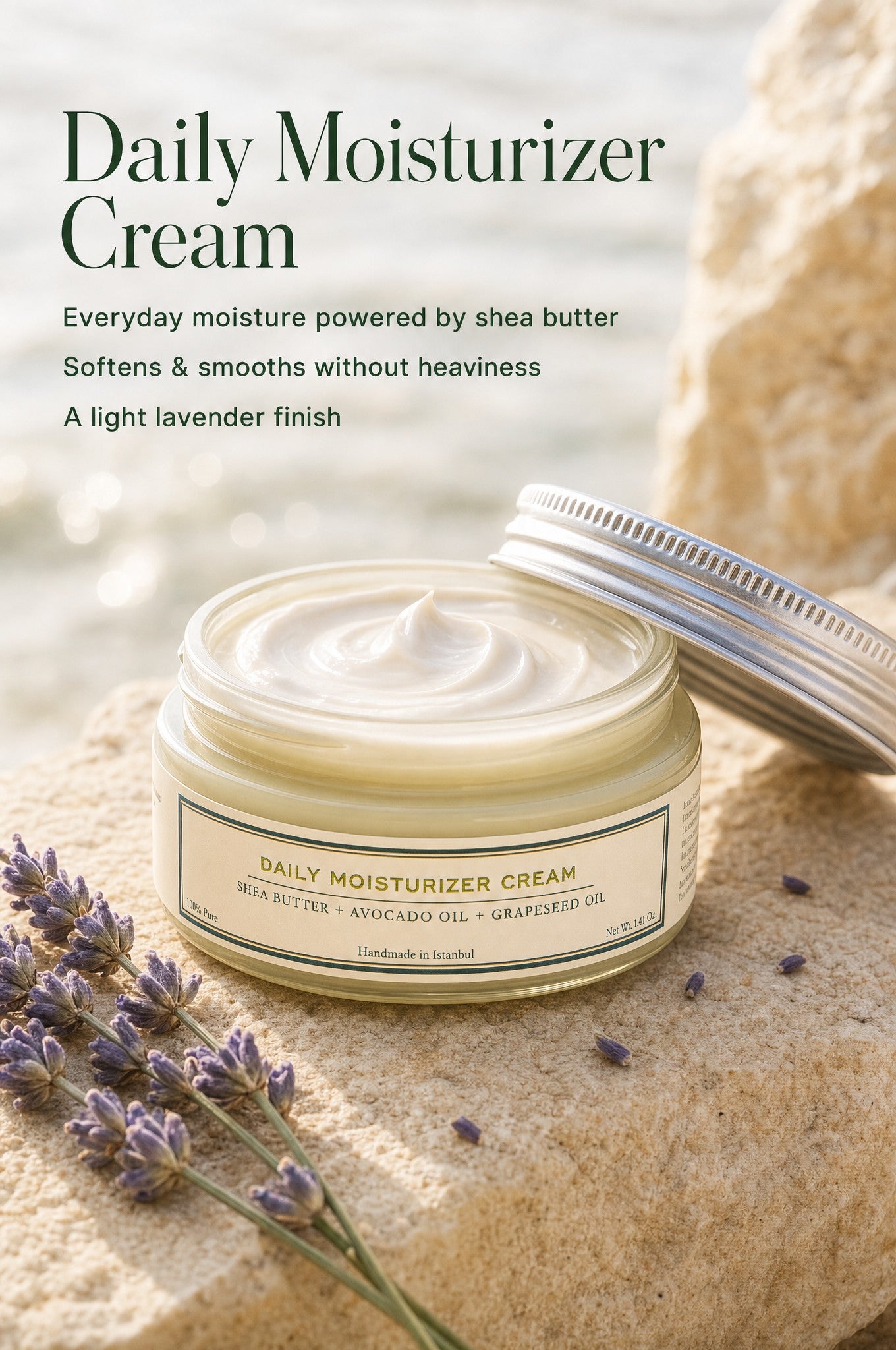 HMA Daily Moisturizer Cream jar with shea butter, avocado oil, and grapeseed oil displayed on sand with lavender flowers and product feature callouts.