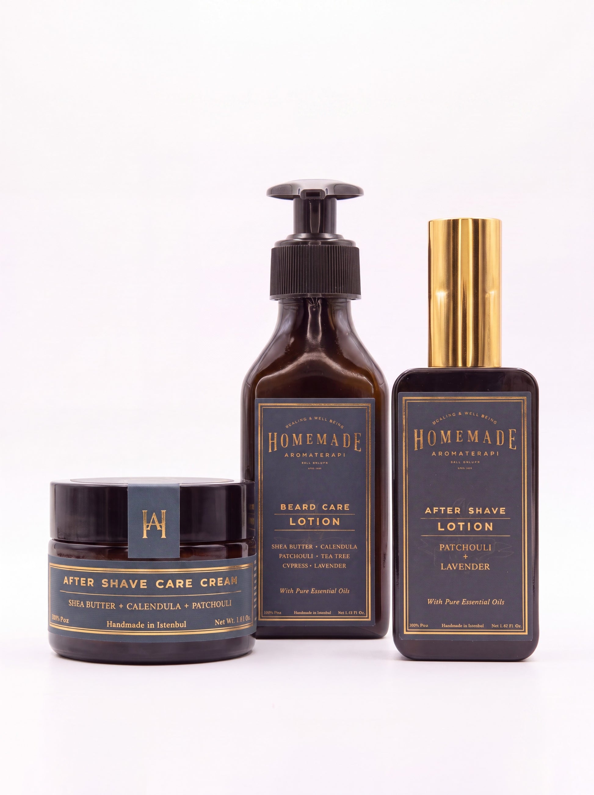 Three dark brown Homemade Aromaterapi men's grooming products including after shave care cream, beard care lotion, and after shave lotion with gold accents on a white background.